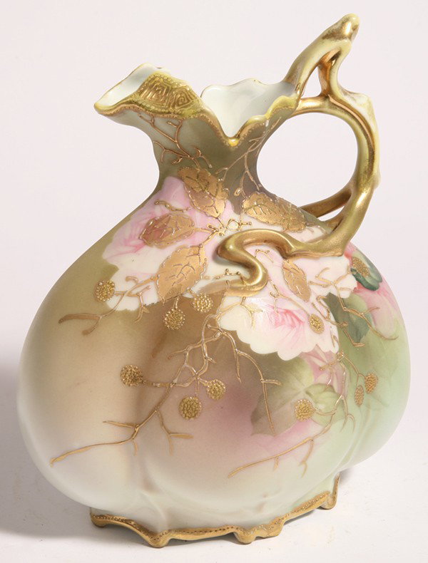 FINE NIPPON EWER: With gilt vining raspberries over painted roses with gilt twig hand. Marked "Handpainted Nippon" with green maple leaf. 9" high.