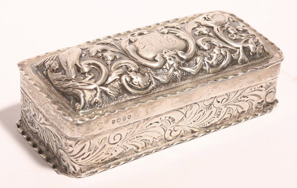 LONDON CHASED STERLING LIDDED BOX: Trinket or snuff with all over chased scroll work with birds. hallmarked on both lid and base, "London, 1888". 4.25" x 2" x 1.5" high. Approx. 2.80 troy oz.