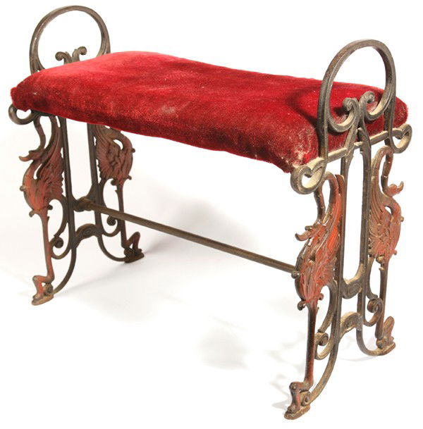 CAST IRON BENCH: With swans and stylized floral in original painted finish. Circa 1910. 24" x 12" x 21" high.