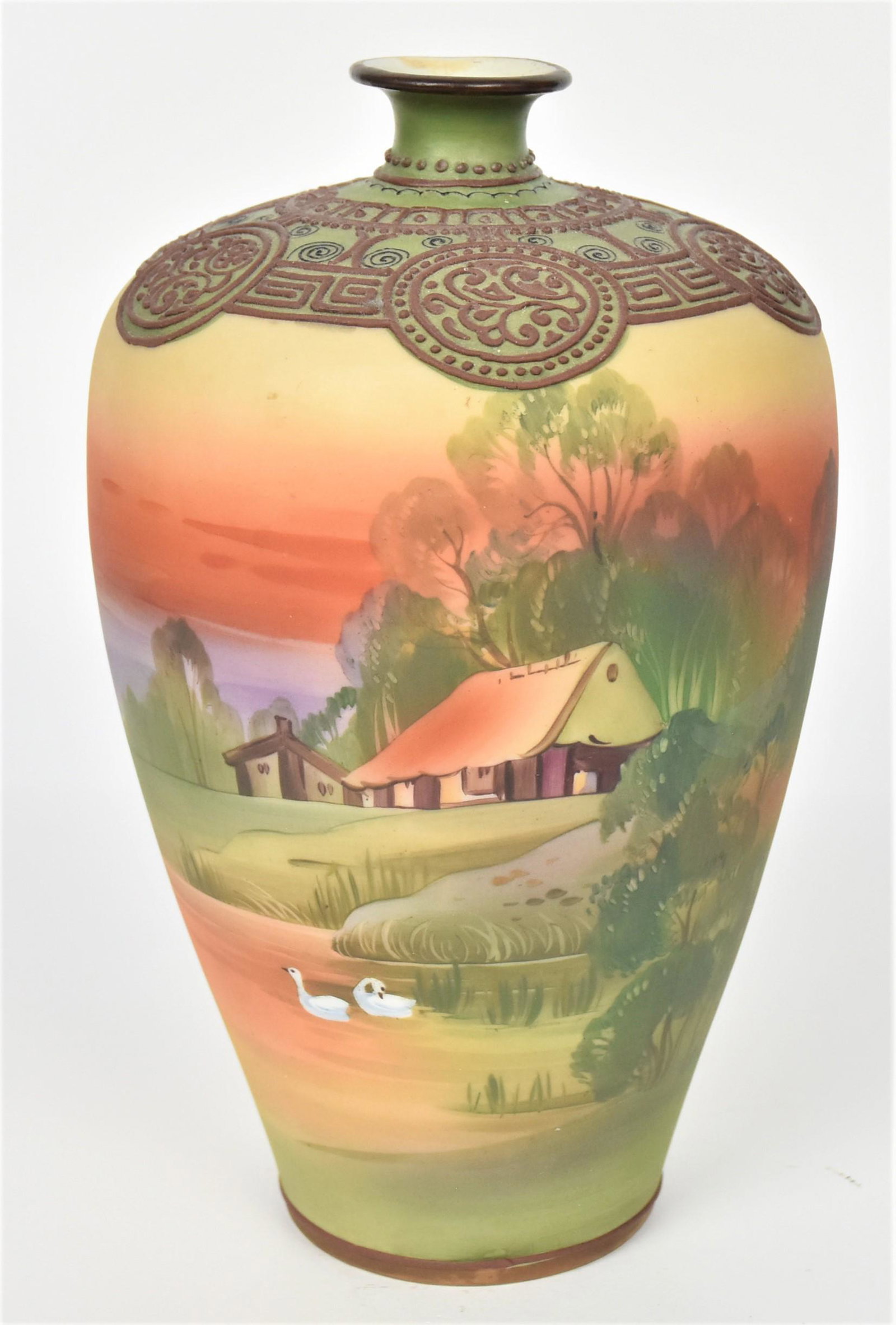 Nippon Scenic Vase with Moriage Trim: Tranquil eventide landscape of home and geese on a lake. Highly decorative raised enamel design on shoulder. 9" tall, M in wreath backstamp. Nice design, repair to rim, otherwise good condition.