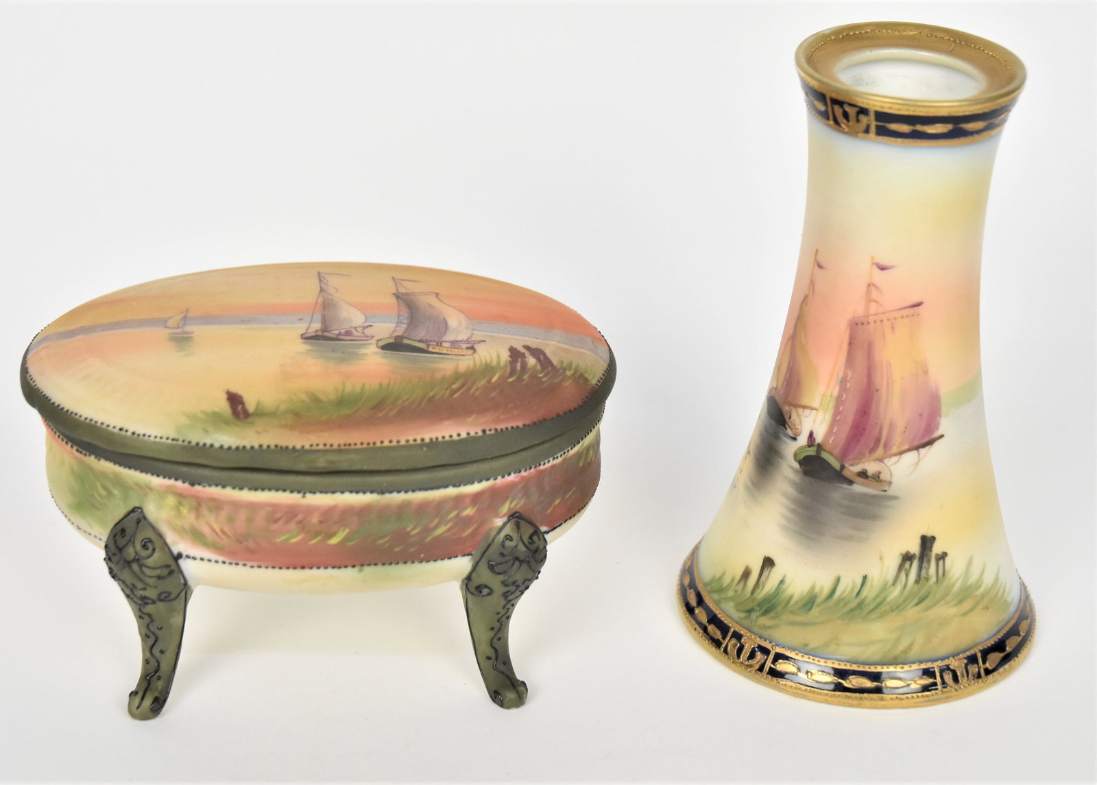 Nippon Scenic Hatpin Holder and Covered Box: Hatpin holder 4 1/2" tall, Covered and footed dresser box. 2 5/8" tall, 4 1/8" long. Both have M in wreath backstamps. Both in good condition.