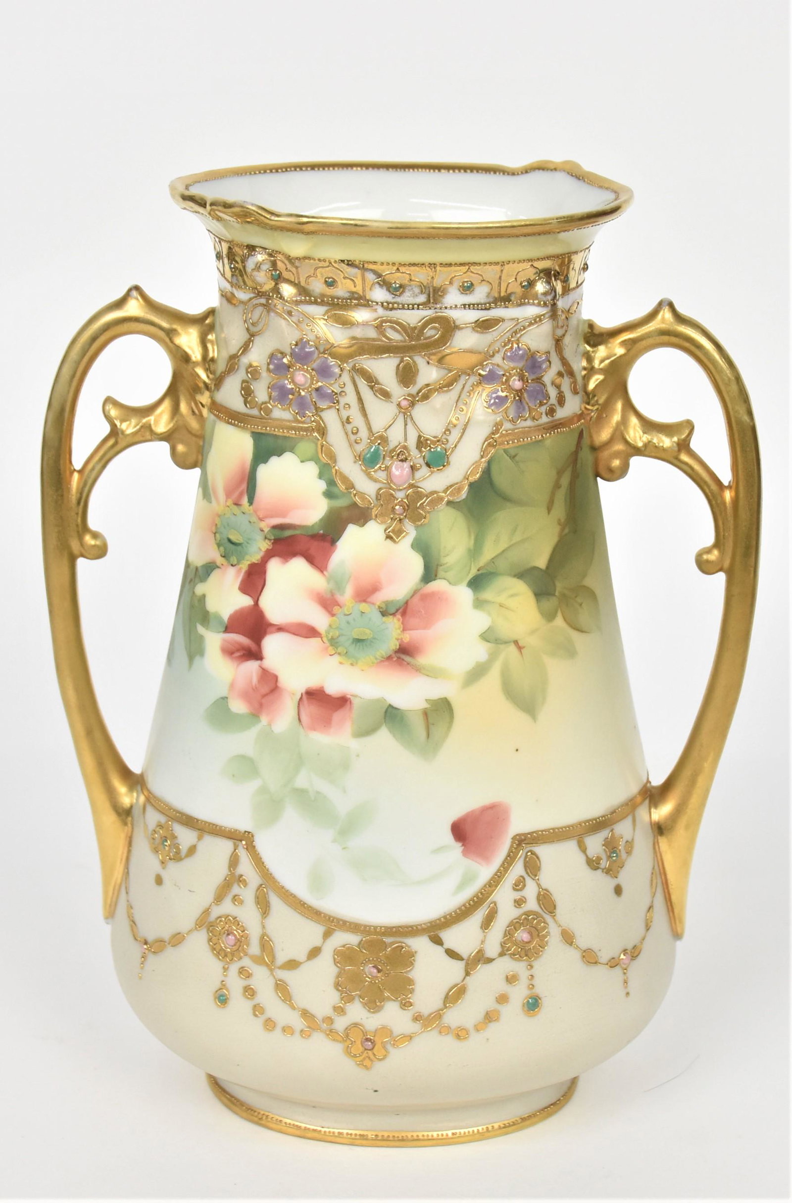 Nippon Jeweled and Gold Vase: Ornate with pastel jewels and gold flowering bordering a panel of rust color wild roses front and back. Gold acanthus leaf handles. Double pull out relief rim 9" tall, 6 1/2" handle to handle. M in wr
