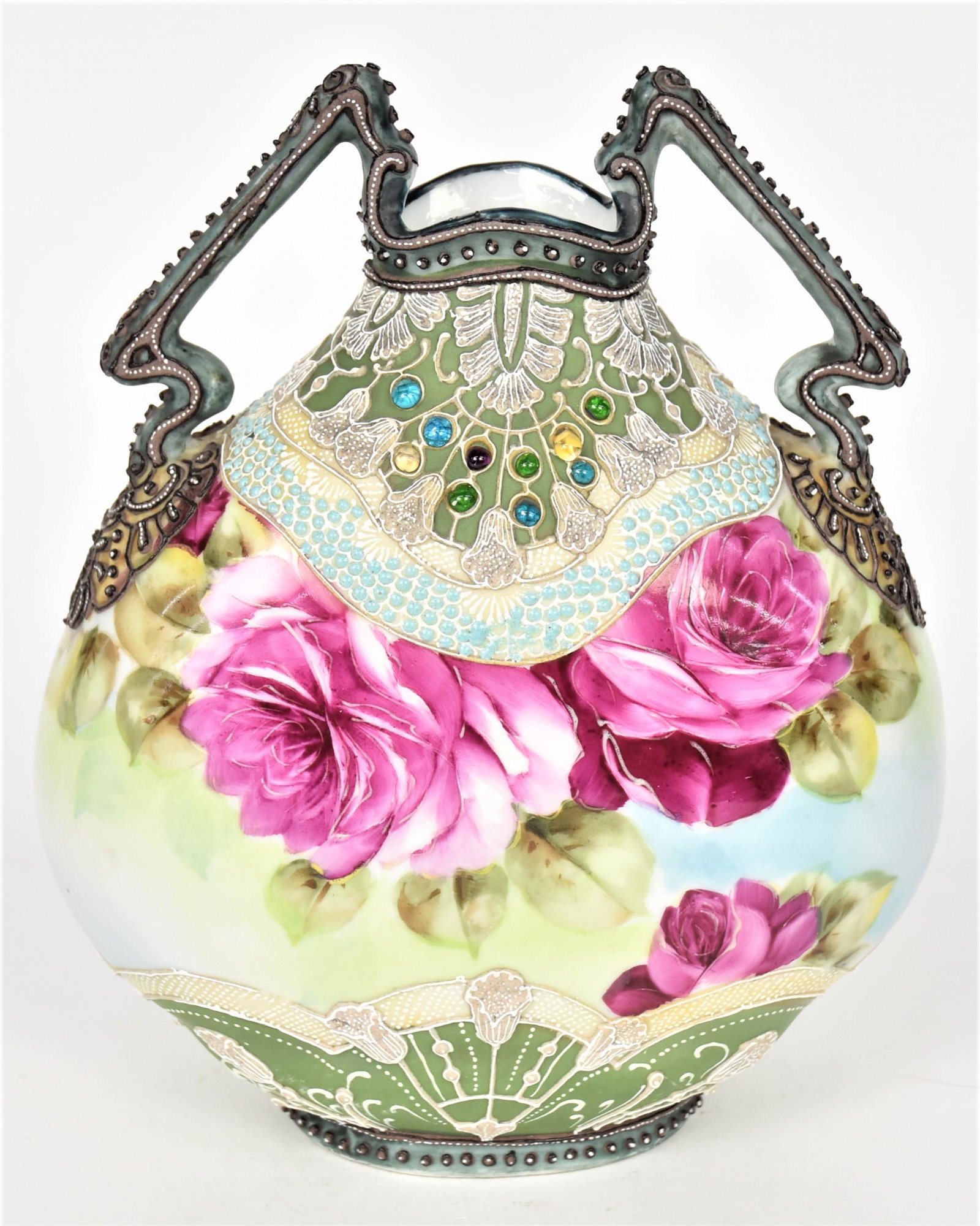 Nippon Moriage and Jeweled Pillow Vase: Elaborate jeweled collar and base, highly decorative handles. Mature ruby roses in between. 7 3/4" tall, 7" across. Maple Leaf backstamp. Highly attractive and in good condition.