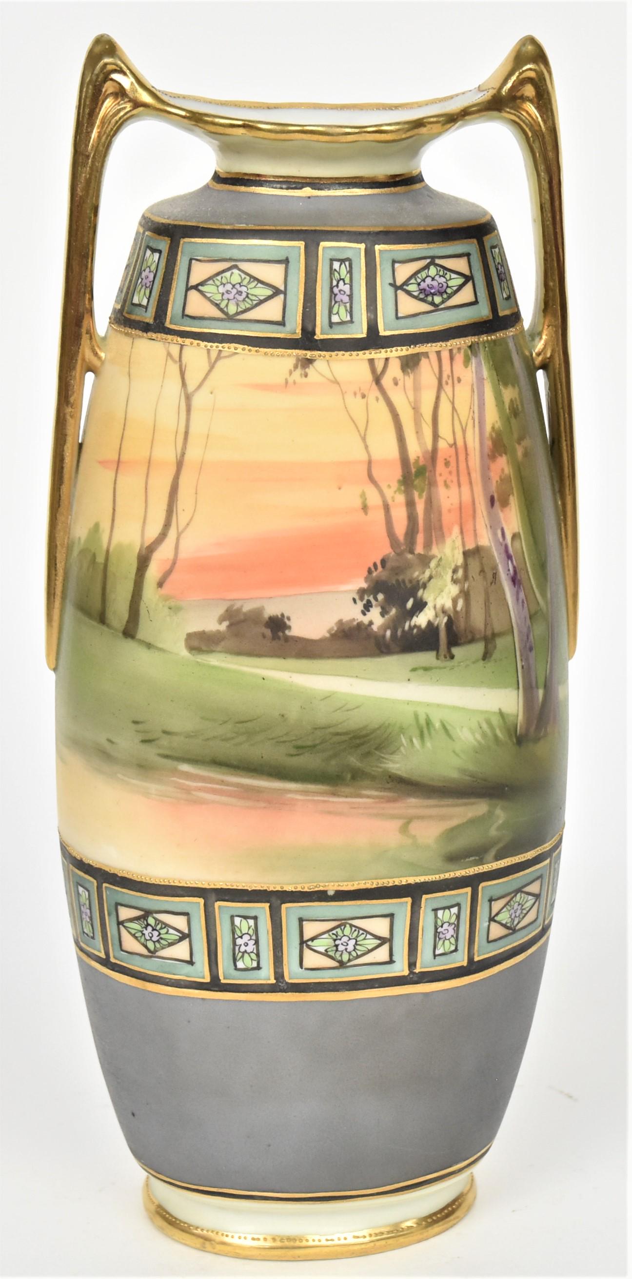 Nippon Scenic Vase: With wooden landscape at eventide. Painted and raised gold borders. Gold handles, 10 1/4" tall. M in wreath backstamp.