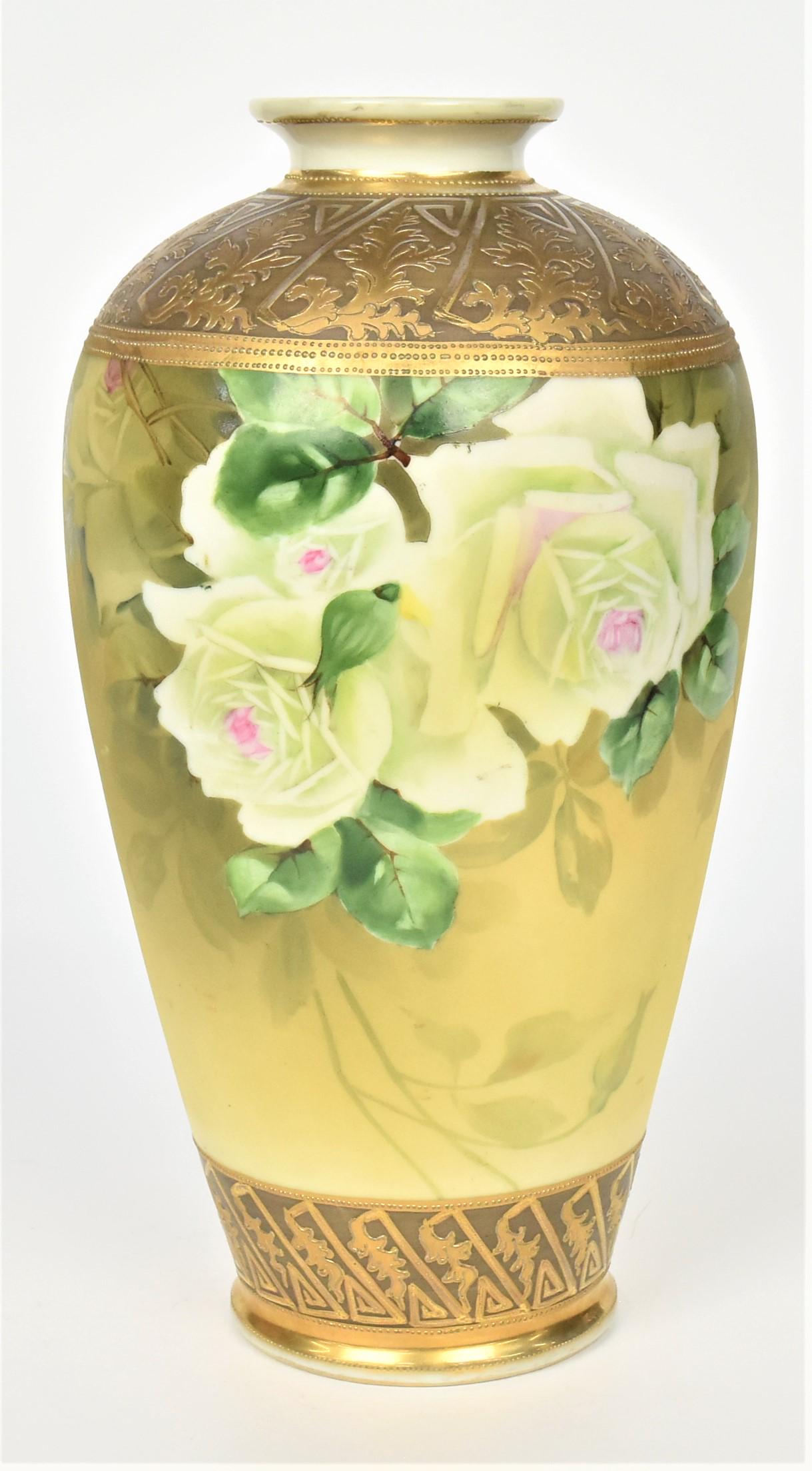 Nippon White Roses Vase: With elaborate raised gold foliage and greek key on shoulder and base. 11 1/2" tall, M in wreath logo. Elegant and in good condition.