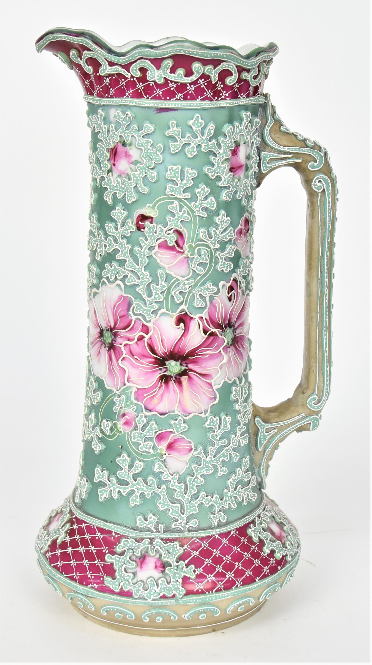 Nippon Moriage Tankard: Featuring all over fernery designs encircling ruby poppy blossoms. 10 1/2" tall, unmarked. Minor misses of moriage to handle. Handsome and in otherwise good condition..
