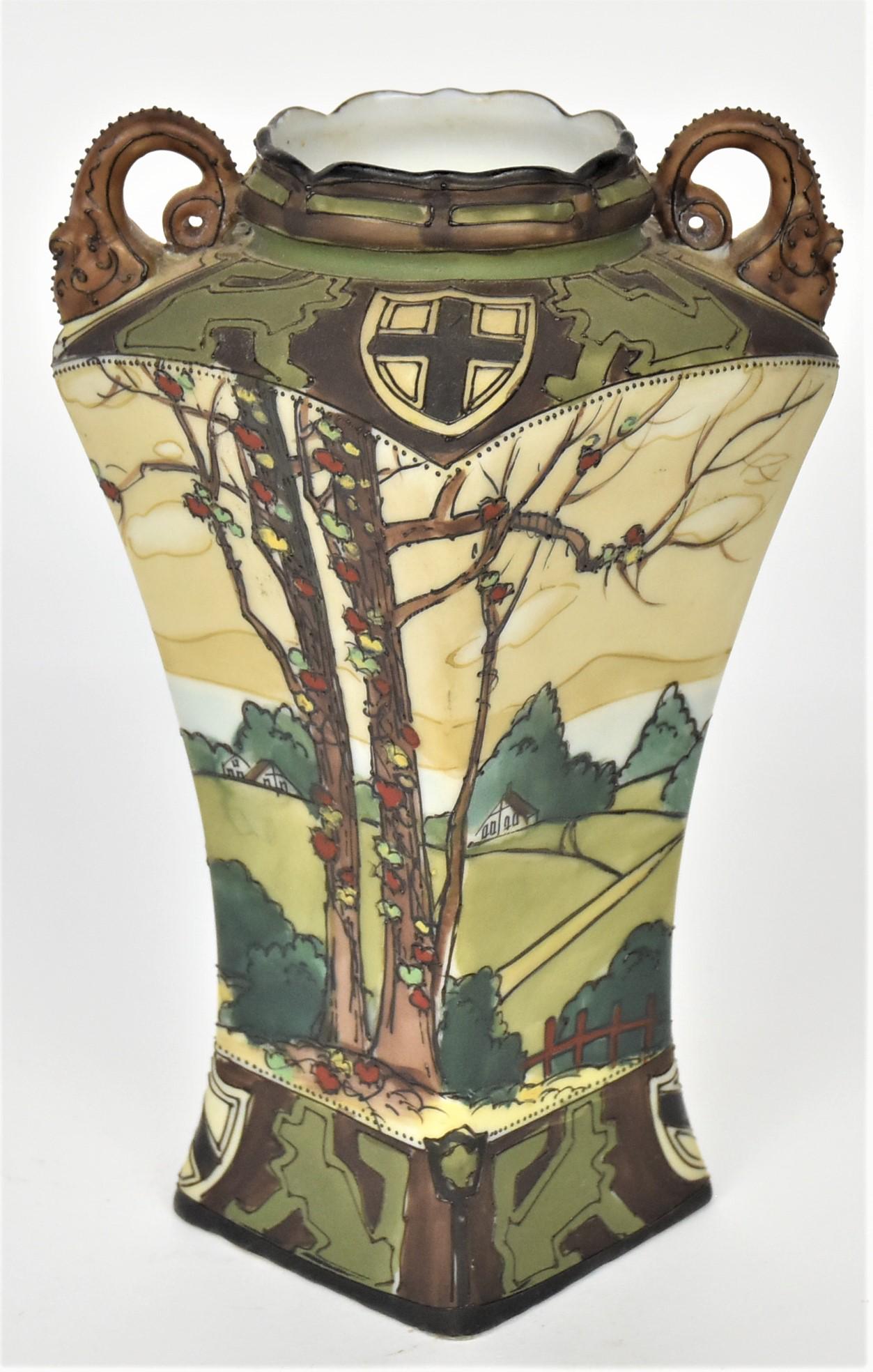 Woodland Nippon Enameled Landscape Vase: Featuring summer scape of homes hidden by rollings hills. Afore trees have autumnal vines climbing trunks and branches. Shields and dog-like painted borders. Dolphin handles, 6 3/4" tall maple leaf lo