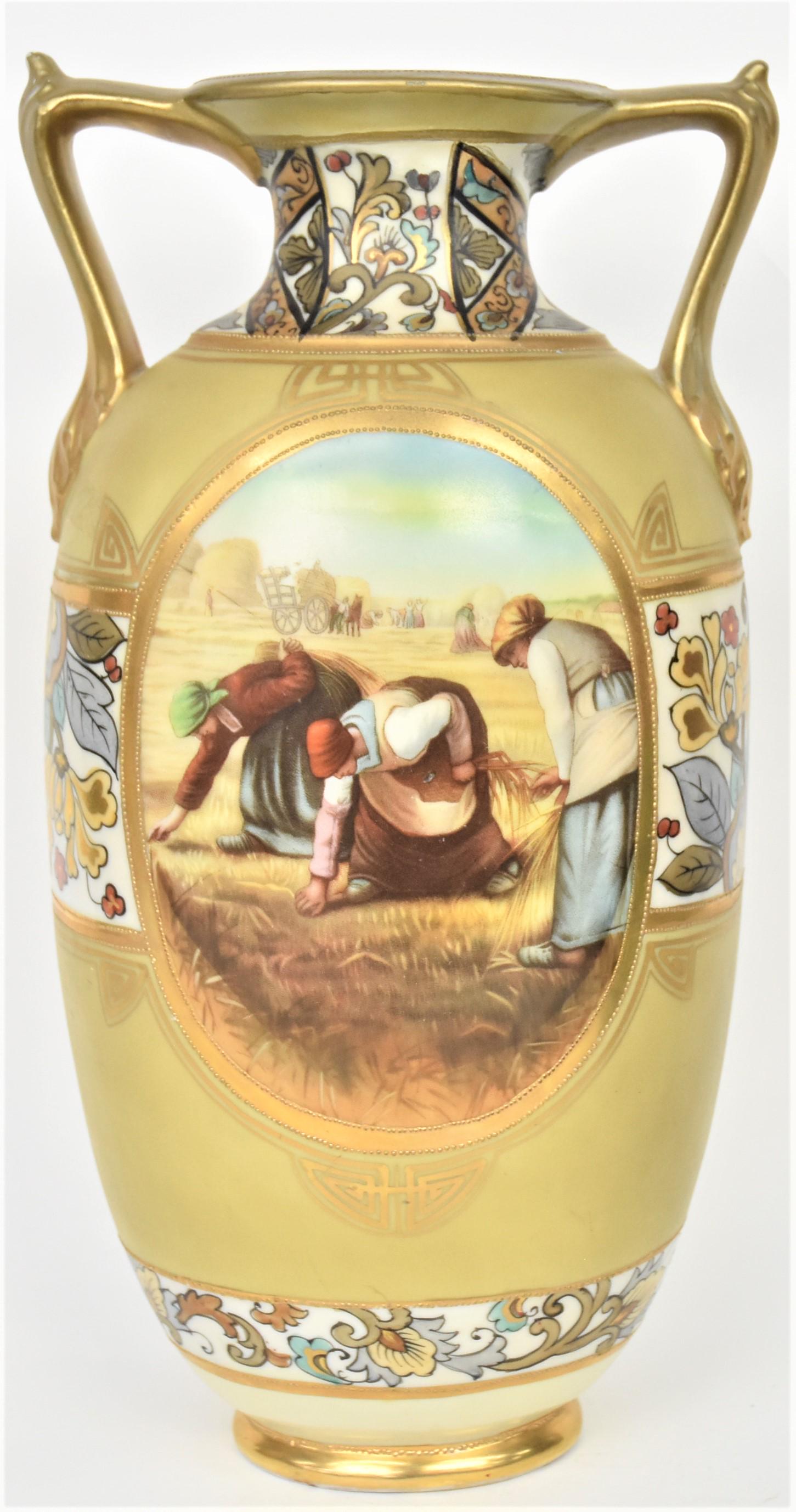 Large Nippon Woman Gatherers Scenic Vase: On front and scenic lake on reverse. Stylized floral bands. Gold ancathus leaf handles. 14 1/4" tall, M in wreath logo. Old repair to rims and handles. Body fine and decorative.