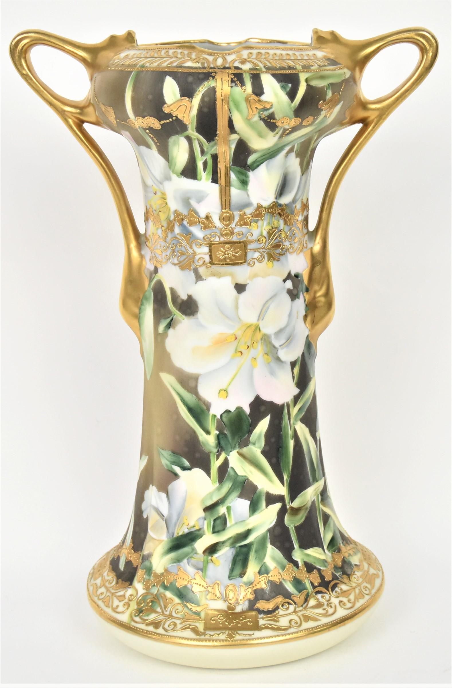 Tall Nippon Lily and Raised Gold Vase: Graceful leaf doubled handles. Lacey raised gold accents, relief rib molded body. 11 1/2" tall, M in wreath logo. Stylish and stately vessel, good condition