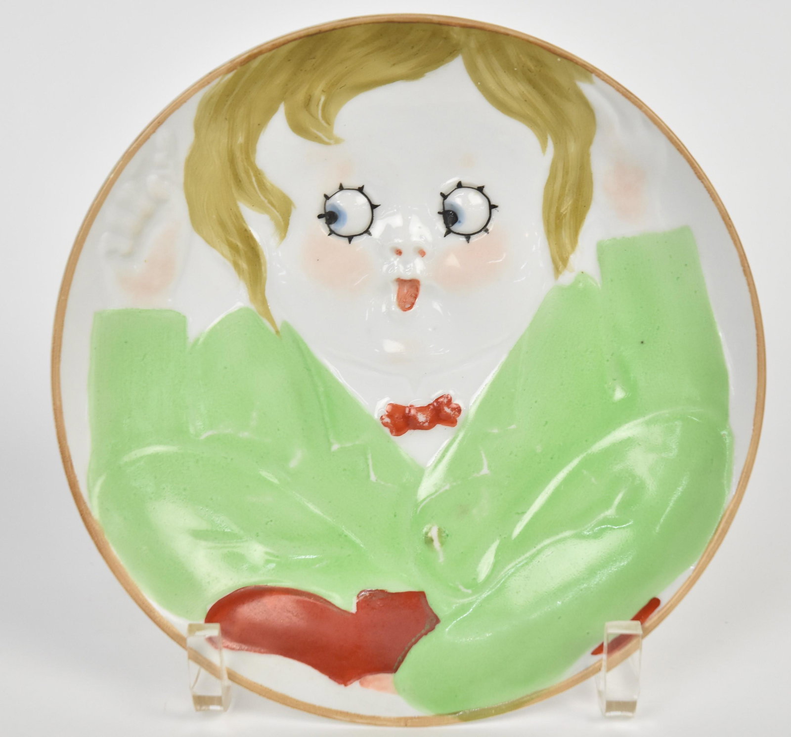 Nippon Childrens Face Wall Plaque: Of a surprised google-eyed toddler. 6"diameter, Sun ray logo.