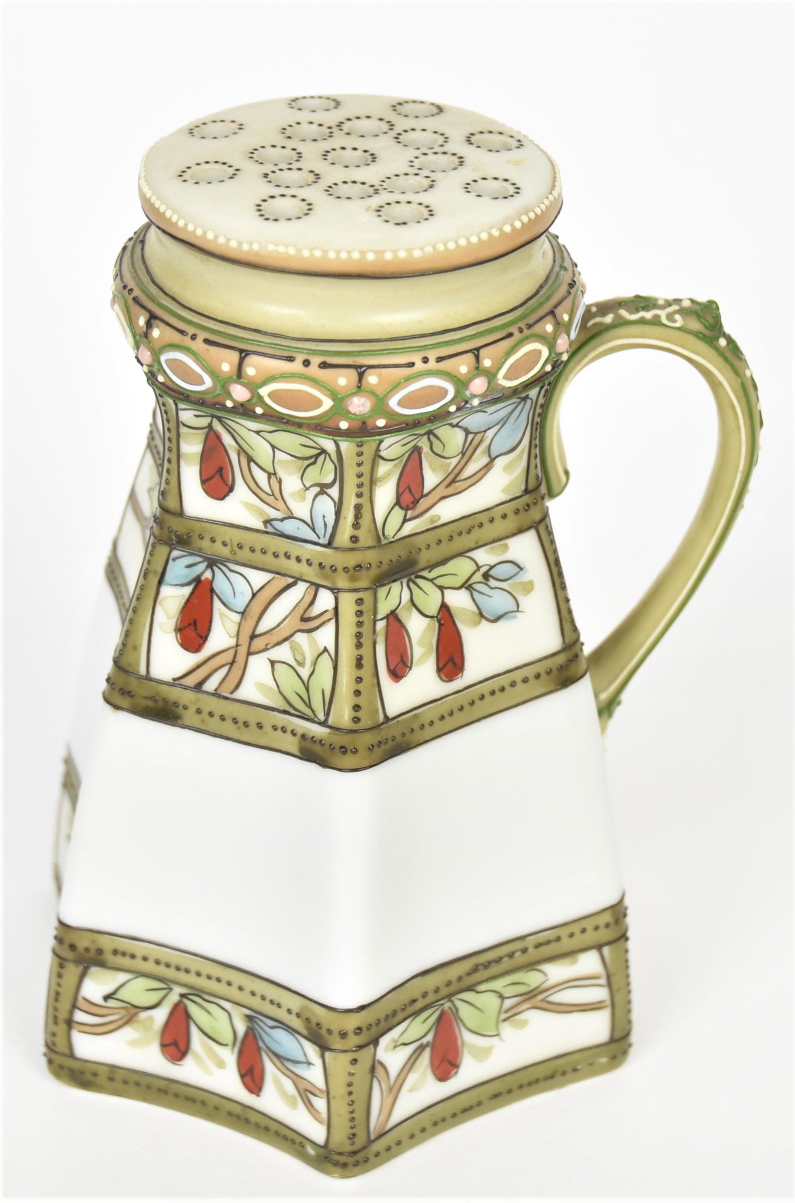 Two Nippon Scenic Steins: One has a palm tree coastal scene, other has a bridge and houses. Both have raised enamel decorated handles. Each are 4 3/4" tall and have the M in wreath logo. Colorful and bold decorations. Good con