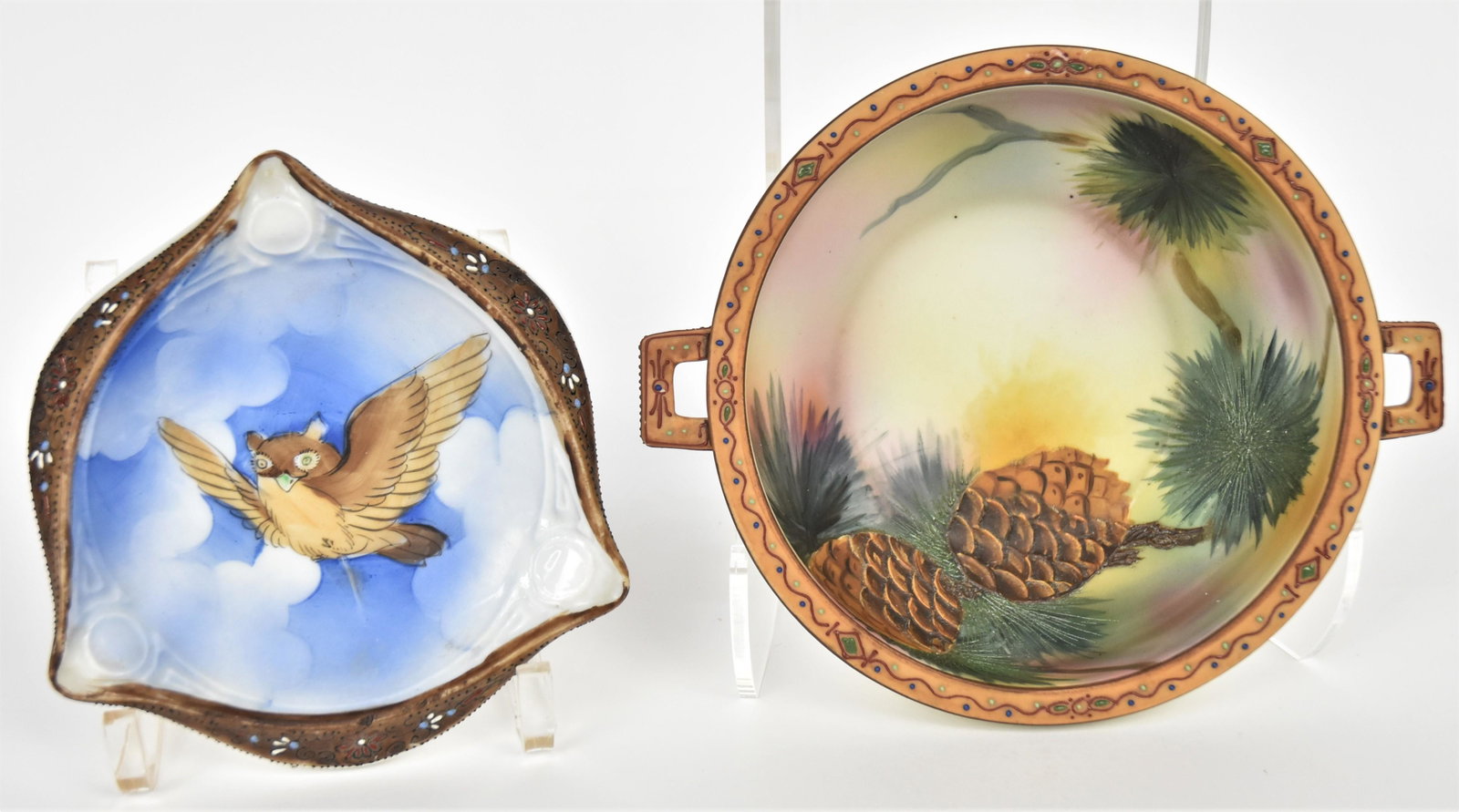Two Nippon Moriage Pine Cone and Owl Items: A handled and footed bowl with raised pine cone and pine needle patters. Decorative enamel trim, M in wreath logo. Painted triangular with enameled border, 5 3/4" across. Hand painted Nippon logo. Bot