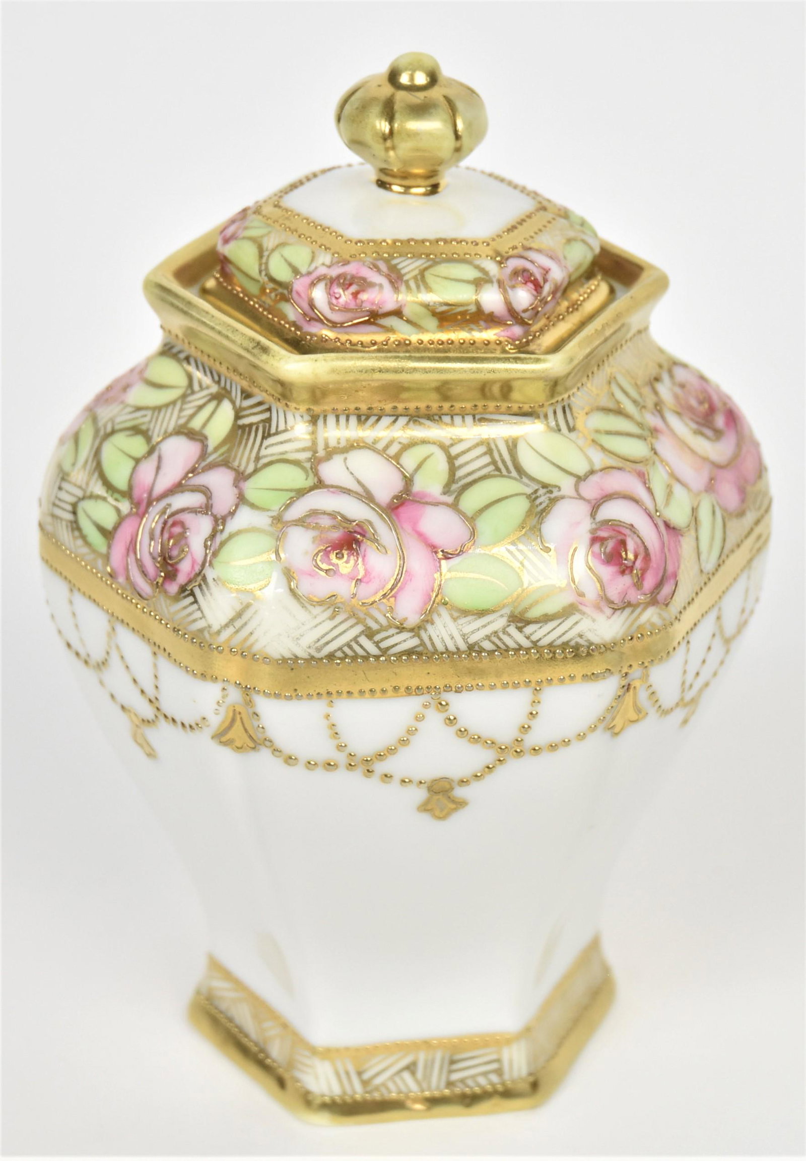 RC Nippon Covered Potpourri: Pink rose shoulder accented with raised gold on hexagonal form. 6 1/4" tall. Attractive and in good condition.