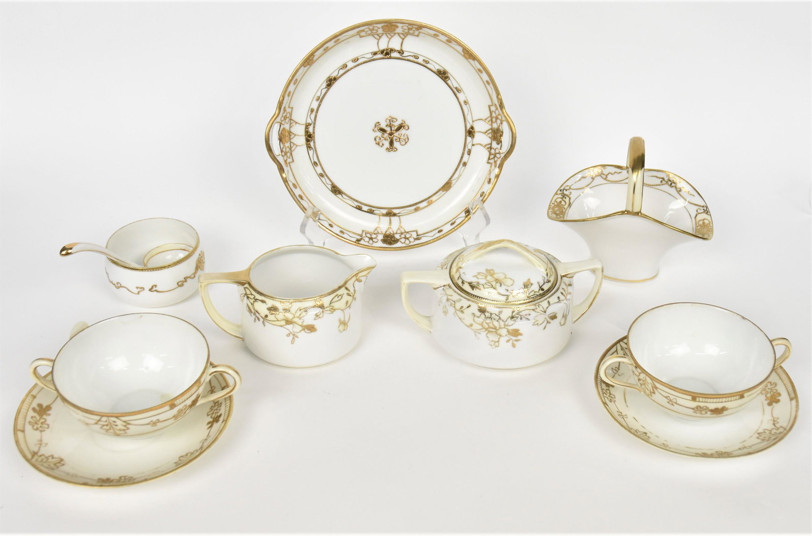Nippon Gold Decorated Pieces: Includes basket, condiment bowl with ladle, cream and sugar, two cups and saucers, and plate basket 4 3/4" tall. Plate is 8" wide. Good condition.
