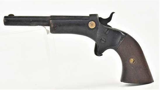 Stevens Tip Up Pistol: .22 caliber in original black finish with round to octagonal 3 3/8" long barrel marked on top J. Stevens A. & T. Co./Chicopee Falls, Mass. U.S.A. withstanding brass front sight & two piece walnut