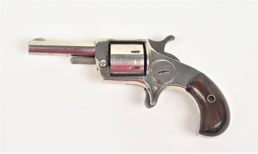 Praitrie King Revolver: .22 caliber, marked on top of round barrel Praitrie King/Pat. Apr. 23 1876 with two piece rosewood grips and original chrome finish, 5 1/2" long. Condition finish circa 85%, else Fine.