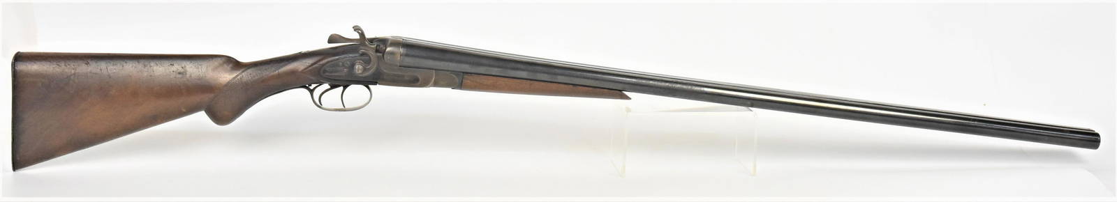 Sam Holt Side By Side Shotgun: Percussion 12 gauge, marked on each side of frame Sam Holt Arms Co., engraved with hounds on frame, walnut forearm and stock with checking at neck and arm, steel butt plate, total length 48 1/2".