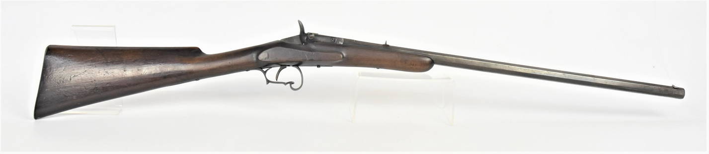 Breech Load Rifle: Unmarked .22 caliber with 23 1/2" octagonal barrel, standing front & rear sights, nice scrolled trigger guard, single piece walnut stock with steel butt plate, untouched finish, 39" long. Condition