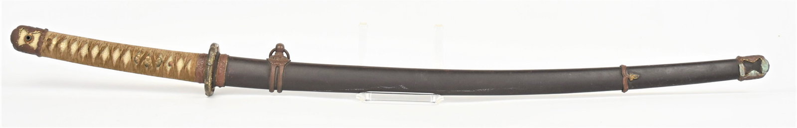 WWII Japanese Gunto Sword: Non-commissioned officers type Katana, unsigned with standard military mounts, 27" single edged blade with false temper line, total length 37 1/2", includes original steel scabbard with brass military