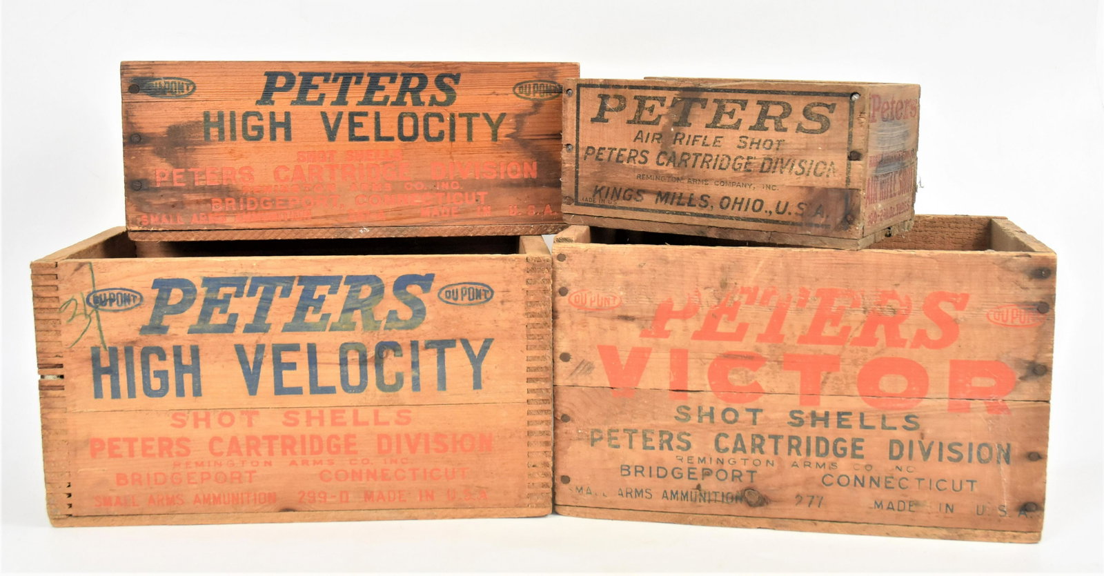 Four Peters Cartridge Crates: Including one dovetailed, 20 Ga. Shells, 14 1/2 x 8 1/4 x 8" high; plus Air Rifle Shot, 9 1/2 x 5 7/8 x 4 1/2" high; plus 410 Ga. Shells, 14 1/5 x 6 x 5 5/8"high; and 16 Ga. Victor Shells, 14 x 8 3/4 