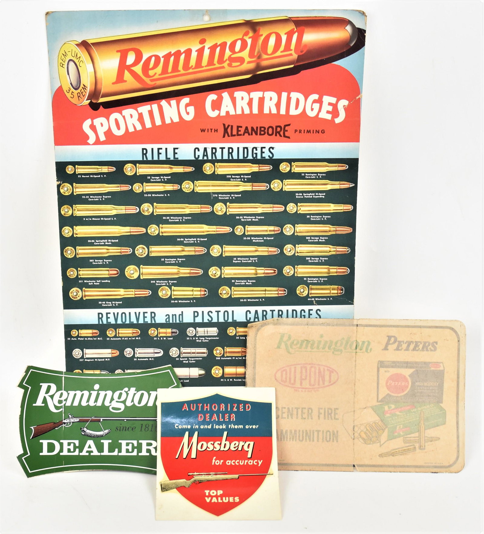 Remington, Peters & Mossberg Signs & Decals: Lot of five, including a fine chromolithographed ammo illustration for Remington Sporting Cartridges on heavy card stock, 13 1/8 x 20 1/8" high; plus Remington 22 cartridge door display card stock chr