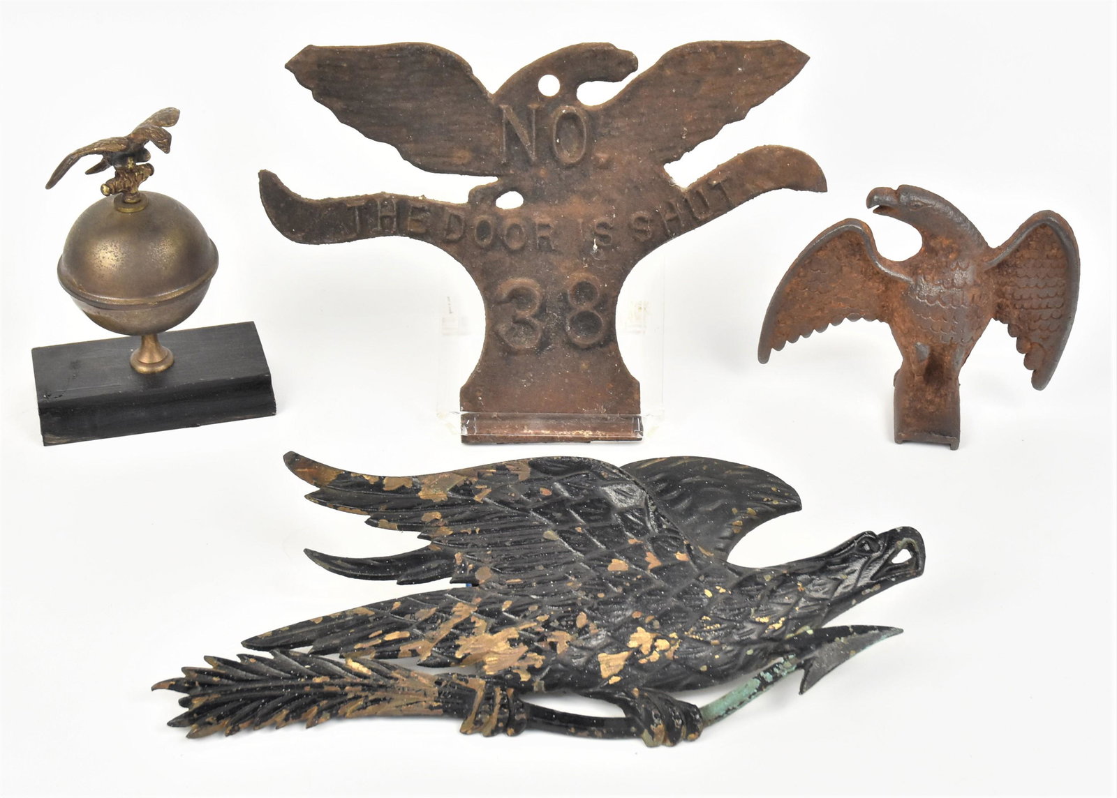 Lot of Eagle Motif Items: Lot of four including a fine cast iron snow eagle, 5 1/2 x2 12 x5" high; plus cast iron spread wing eagle, relief wall mount with No. 38 The Door Is Shut, 11 x7 3/4" high; plus wall mount cast iron ea