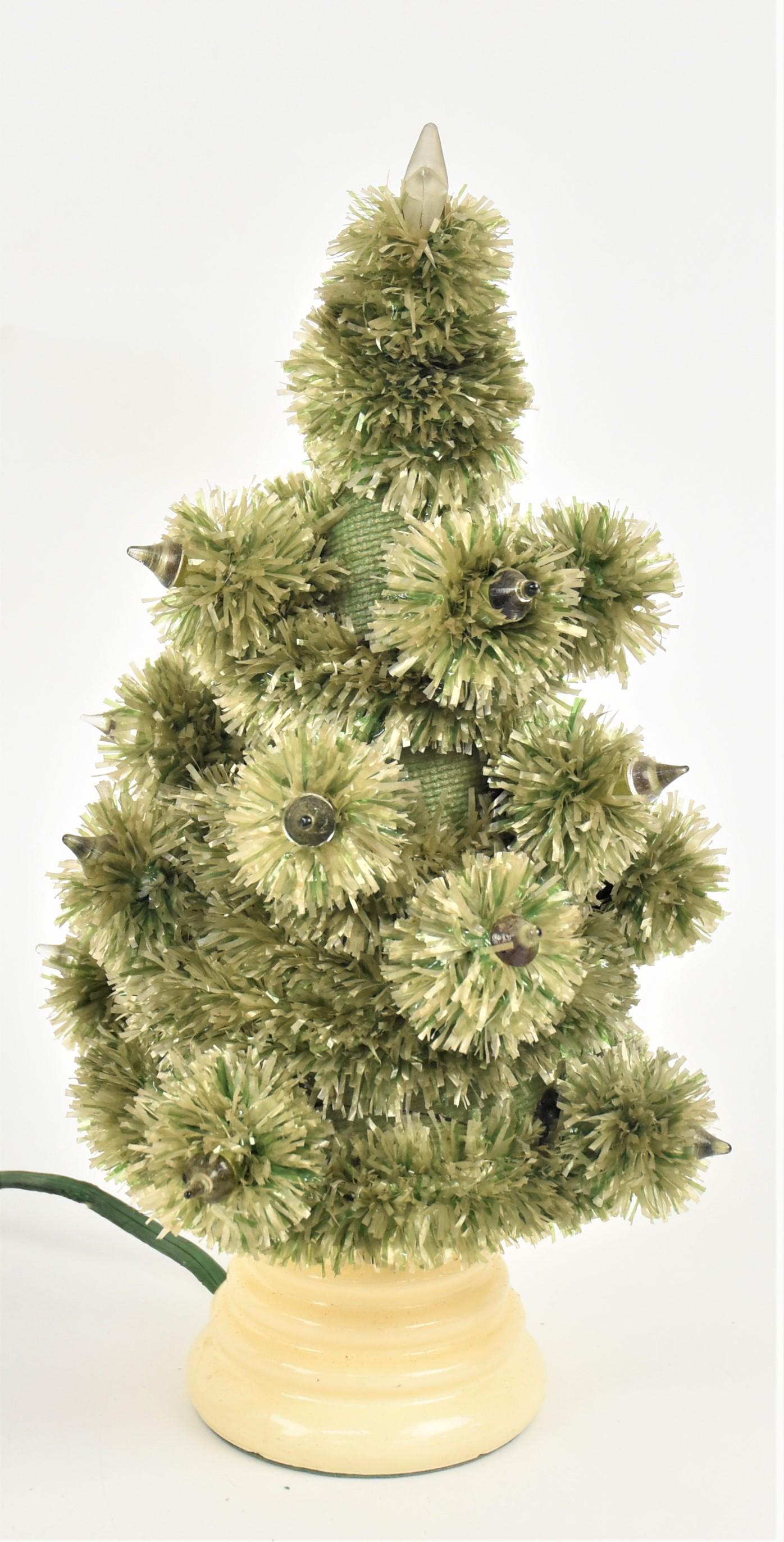 Lighted Feather Type Tree: In original illustrated box labeled Cloth Christmas Tree Color No. 12 with green lift off tree with frosted glass star finial and many pointed glass rods that are socketed through card stock cone on w