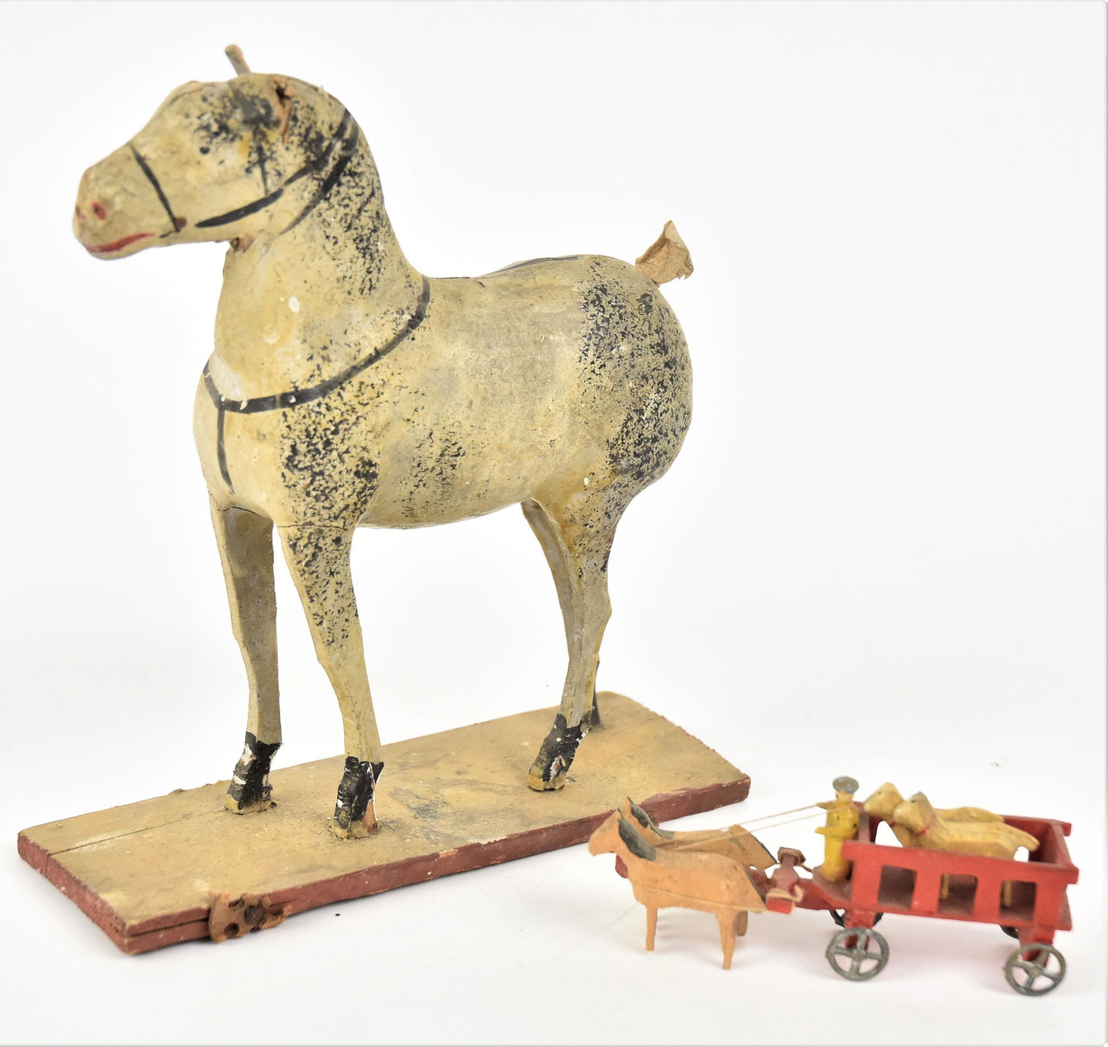 Two Early Pull Toys: Including a papier-mache and wood standing horse in original white and black painted finish with leather tail, on painted wood base, 5 7.8 x 2 1/8 x 6 7/8" high; and carved and painted wooden farm wag