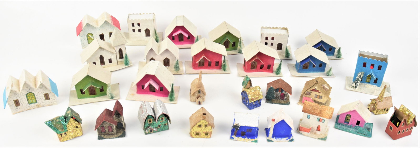 Christmas Village: Lot of 37, all card stock with decorations, including set of 13 in original box from Sears entitled Lighted Village Set, 16 1/4 x8 1/2 x 3 1/4" high; and 24 other building. Condition minor damage to a