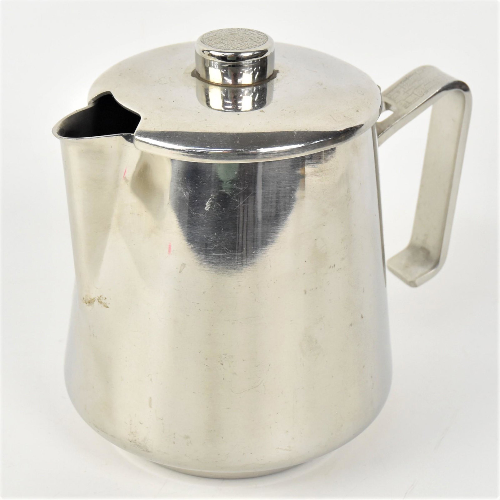 TWA Coffee Pitcher: Chrome circa 1950swith oriental patterned handle and finial, marked on base TWA Oneida 44-1544, 7 1/4 x 5 1/4 x 6 1/2" high. Condition Fine.