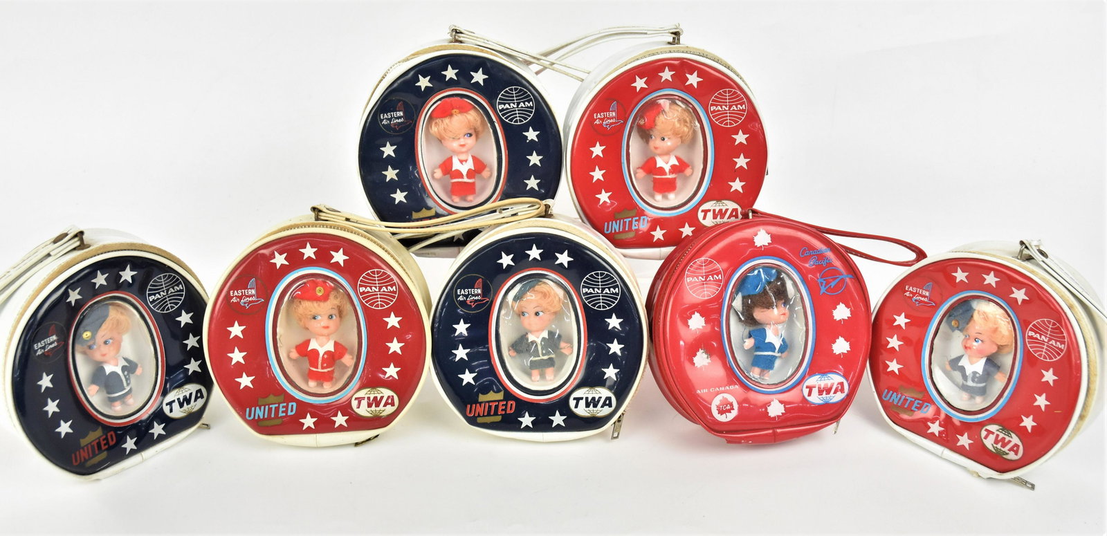 Seven Stewardess Dolls in Bags: Gifts given to female child passengers, made in Hong Kong, plastic zipper lock bags are in three different styles and two colors, given out by TWA, Pan Am, United, Eastern, Canadian Pacific & Canada A