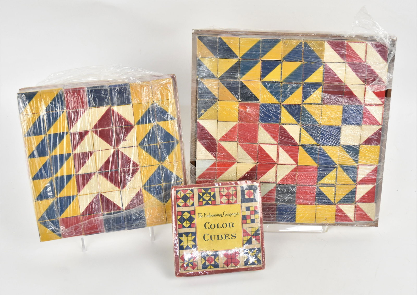 Early Painted Wood Blocks: Three graduated nested sets, all in red, white blue and yellow paint, smallest set has sixteen 1" square blocks, middle set has 49 block and largest has 81 blocks. Condition very slight wear, VG.