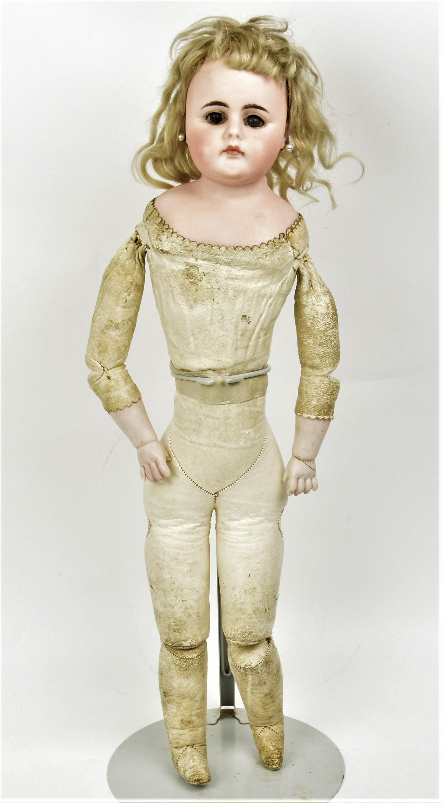 Kestner Close Mouth Lady Doll: Shoulder plate with fixed brown glass eyes, closed mouth, perced ears, original blonde wig on domed head, bisque lower arms/hands on fine kid lady body, 20" tall. Condition minor soil, else VG.