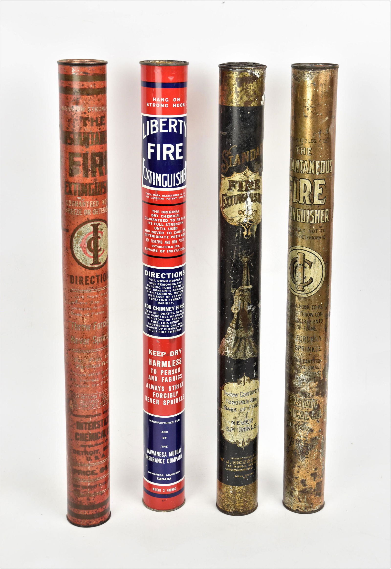 Four Early Tin Tubular Fire Extinguishers (1 of 3)