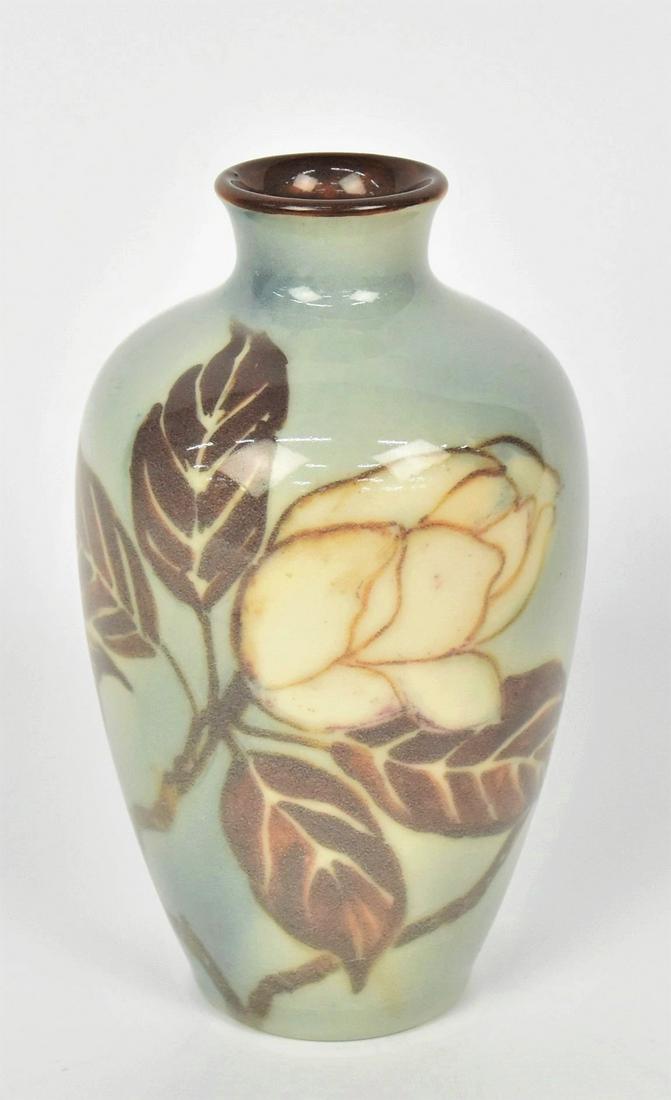 Rookwood Porcelain Glaze Vase by Elizabeth Barrett: With magnolia branch 7 3/4" T, Impressed with company logo, 1945 date, 6362 shape, Incised with artist monogram & 3084, sparce crazing, Good condition. Pleasing design.