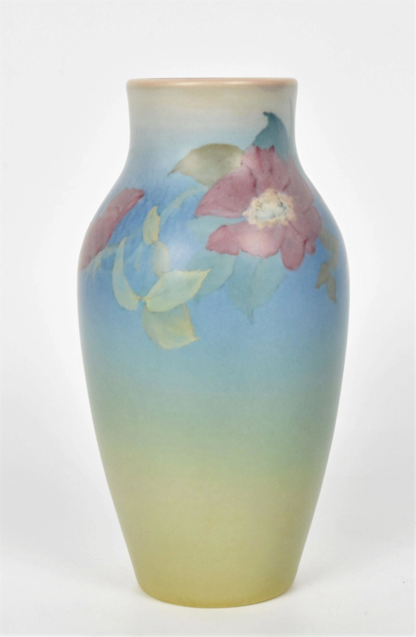 Rookwood Vellum Vase Painted by Ed Diers: With red wild roses encircling the shoulder. Impressed with the factory logo, 1929 date, shape 926D , and the incised artist monogram. Uncrazed. Height 7 12"