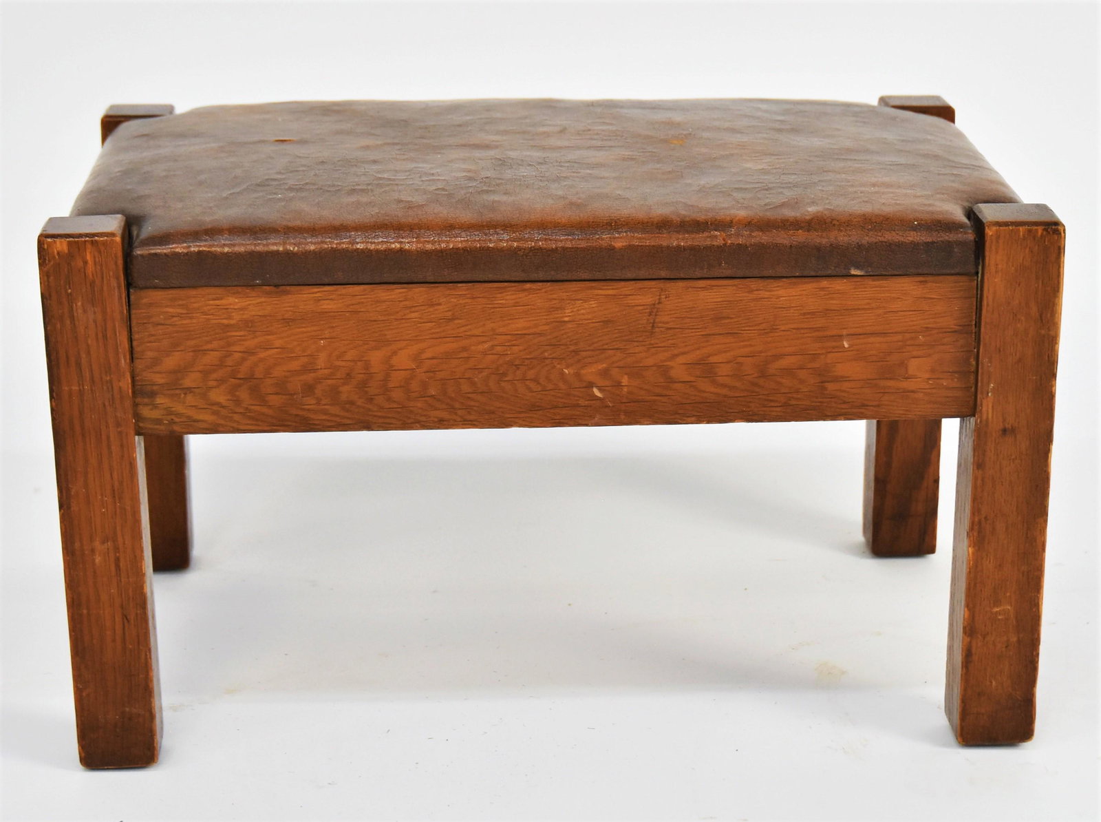 Arts and Crafts Mission Foot Stool: Oak, with letherette covered top, very good original golden brown finish, very good condition 11 H x 20 W x 13 D.