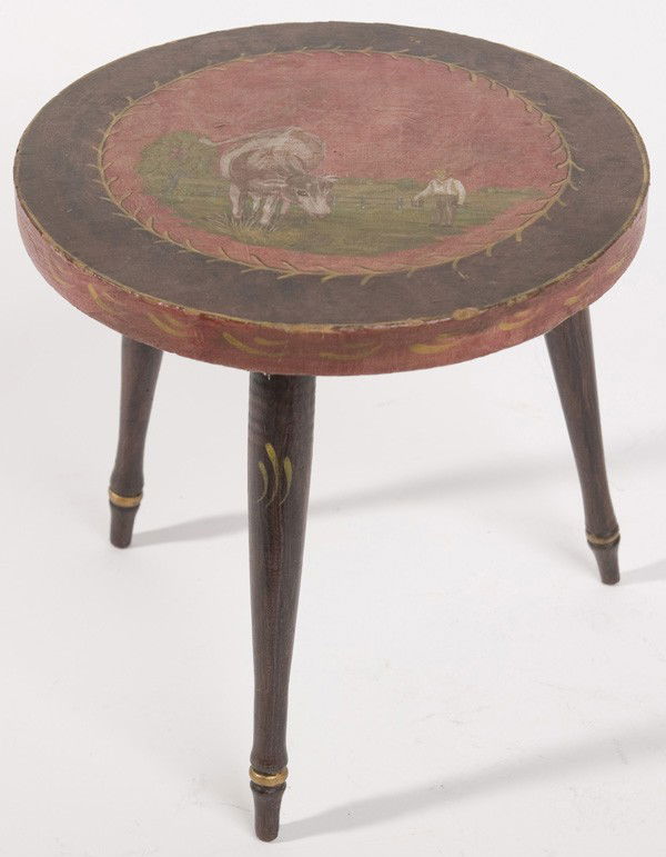 FOLK ART PAINT DECORATED STOOL WITH COW: Mid-19th Century Folk Art stool with a paint decorated scene of a farmer and cow on top resting on three paint decorated legs. Good condition. 10" high x 10" diameter.