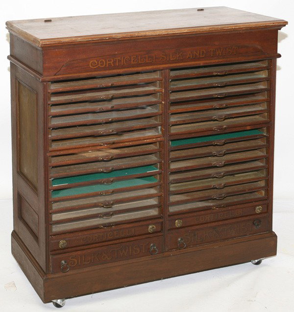 LG. 30-DWR. CORTICELLI OAK SPOOL CABINET: Original Corticelli Silk & Twist stenciling at top, bottom drawers and sides. Lift top. 45" high x 43 1/2" wide x 16 1/2" deep.