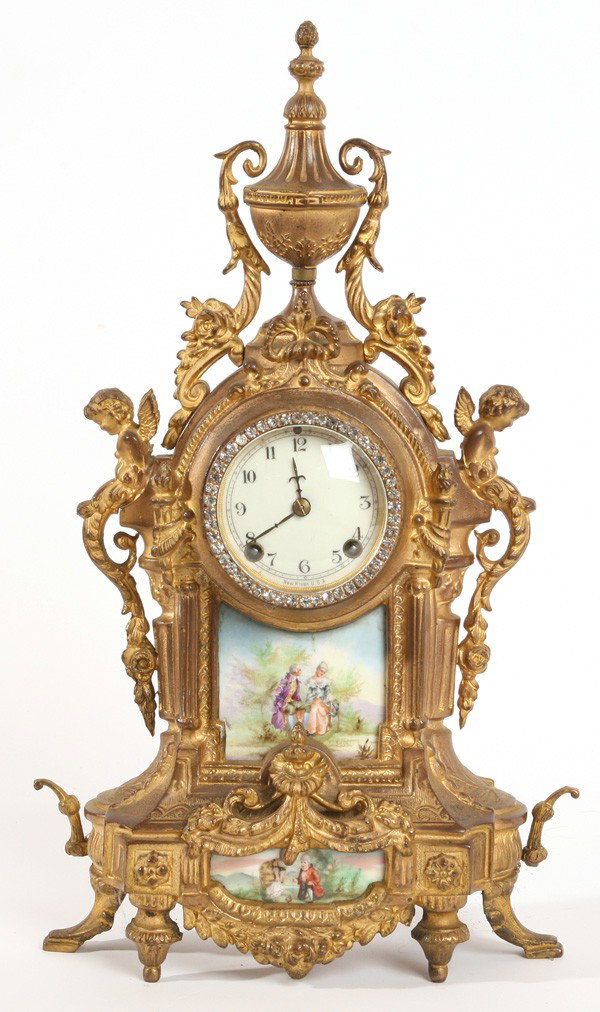 GILT BRONZE & PORCELAIN NEW HAVEN CLOCK: With two serves type panels, hand painted with courting couples. Porcelain dial marked "New Haven U.S.A.", eight-day timer and strike spring driven brass movement. Wear to gilt, lacking pendulum and k