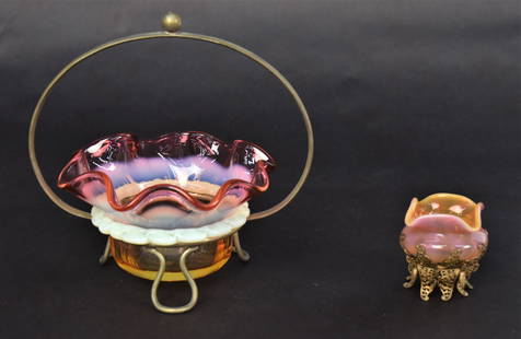 Art Glass Amberinia Bowl, Plus: Monart Strump Salt cellar caressed with filagree butterfly holder 2" H, Plus 2 3/4" H opalescent amberina relish bowl with rigaree collar resting within a wire frame, 6 1/2"H. All in good condition.