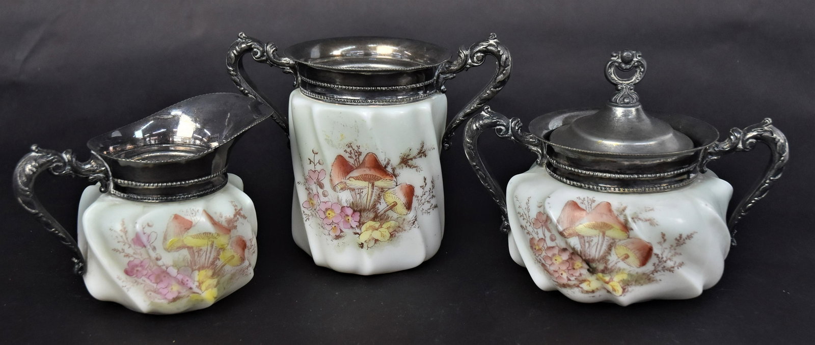 Three Matching Wavecrest Table Set: With unusal mushroom designs, 6" covered jar, 3 1/2" creamerand a plus a 3" open sugar. Good condition. to all.