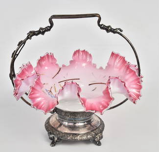 Shiny Peachblow Brides Basket: Enamled floral decorations fitted within a Wilcox Silverplate frame. Bowl measures 10 1/2"H x 10 3/4". As Is frame, otherwise good condition