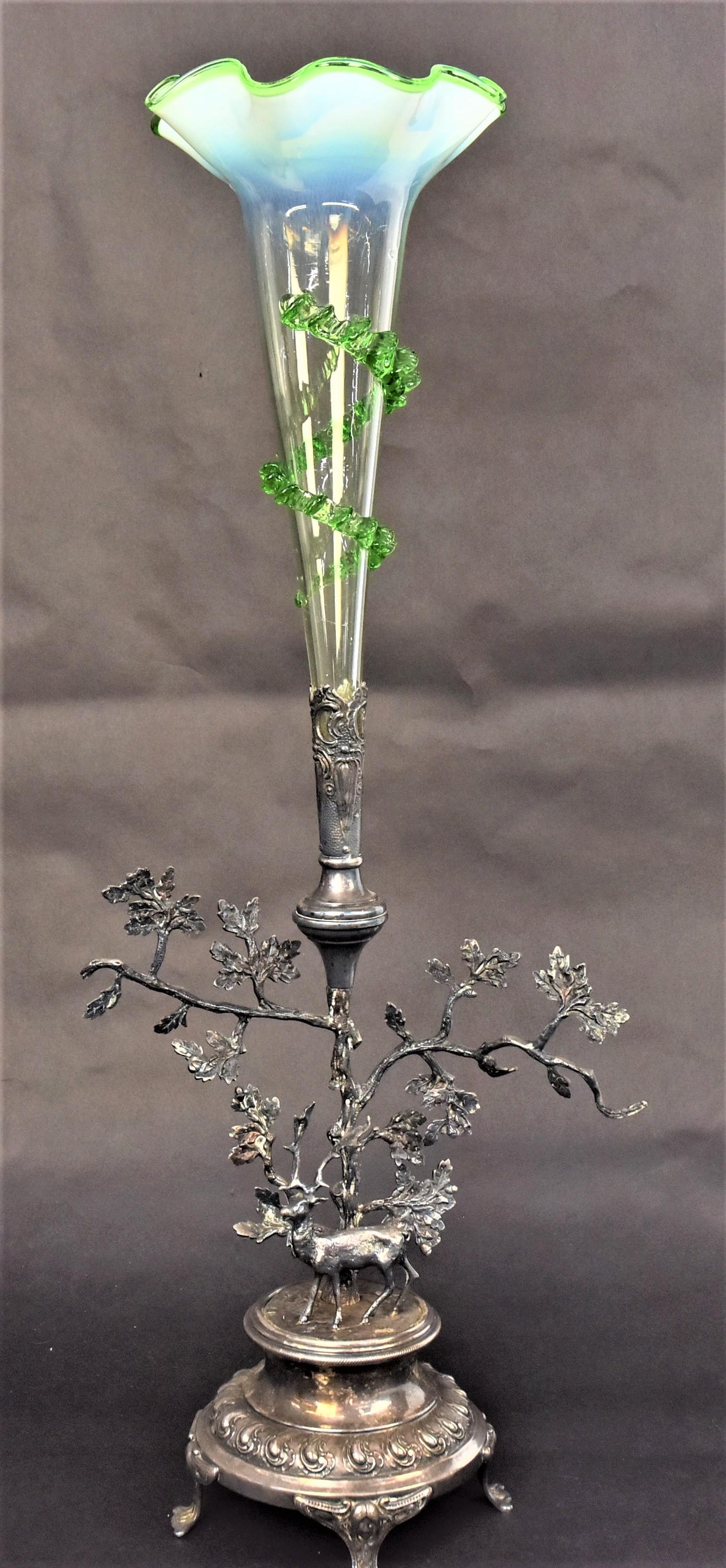 Showy Victorian Art Glass Epergne: Two pieces. Green rigeree trim vase mounted within an ornate figural oak tree and stag silver plate holder. Combined height 25 1/2", 10" Across branches, Highly Decorative. There is a very small pc of