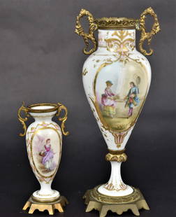 Two Severes Type Porcelain Mantle Vases: Hand Painted with victorian figures, tallest 10 1/2" is artist signed E. Clement, Shortest is 6" H, both have ornate metal trim. Good condition.