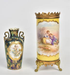 Two Severes Type Porcelain Vases: Lustre 4 1/2" high, Hand Painted with cherubs marked Royal Vienna, Germany, 6" spill vase Hand Painted with lovers by artist Reiguor, Marrked France with S in scrolls, metal mounts.Both good condition