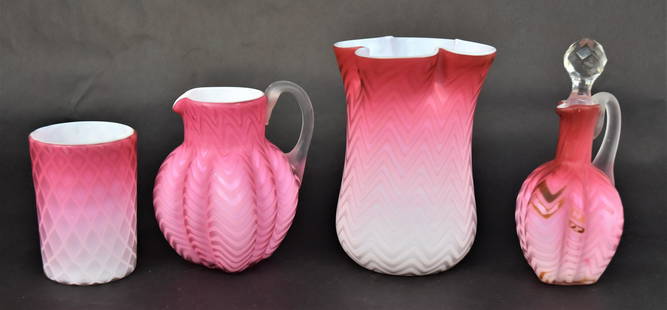 Four Pink Mother of Pearl Harringbone & Diamond Quilted Pieces: A 6 1/4" vase with quadrafoil rim, a 6 3/4" cruet with cut stopper and frosted handle, has discoloration, a 5 1/4" ribbed milk pitcher with frosted handle and a 4" cased tumbler. All otherwise good