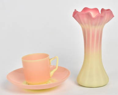 Two Burmese Vase & Cup And Saucer: Delicate 6" Webb acid vase with petal top rim & ribbed body, a shiny Mt Washington 2 1/4"demitasse cup with 5 1/4"dia saucer. Beautiful colors. Good condition..