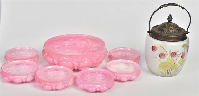 Victorian Art Glass Cracker Barrel & Berry Set: Pink cased berry bowl 3"H x 8"W with six matching individual bowls 1 1/2" x 4 1/2"dia. Blow out beaded drape pattern, usage flakes to all rims, plus a frosted cracker barrel with enamel strawberry des