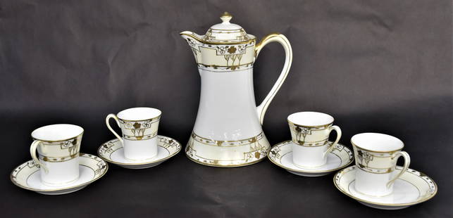 Nippon Hand Painted Chocolate Set: M in wreath marked consisting a 9" large pot, four 3" cups plus four 5" dia saucers. Handsome set in good condition.